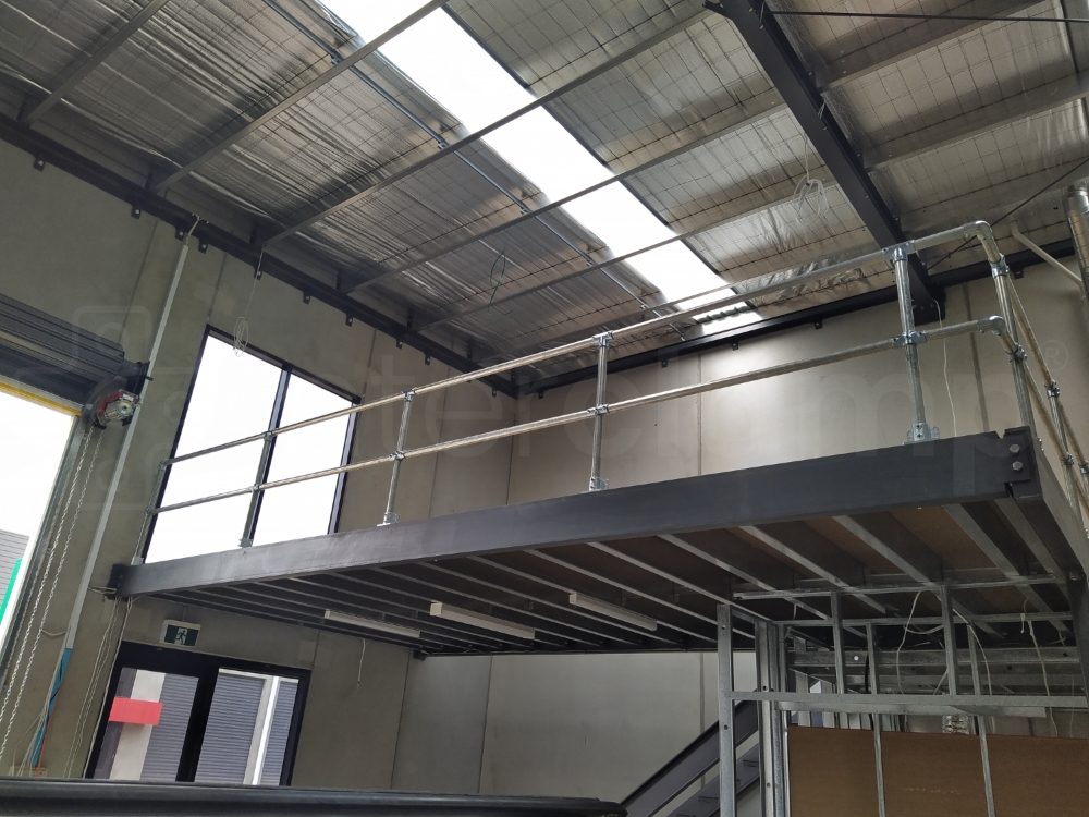 Interclamp tube clamp balustrade installed on a mezzanine floor and the a Interclamp DDA system constructed on the access stairs